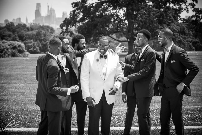 The groomsmen having fun with the groom at Fairmount Park